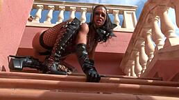 a horny bitch in lacquer and leather dances