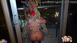 Man, that big booty white girl is sucking off a BBC clown on a high rise patio at NYE!