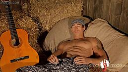 Gay Asian Muscle Guitarist Plays On The Hay.