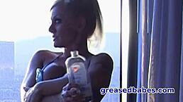 charity mclain, that busty milf, oils up her bikini body and masturbates with a glass dildo