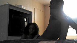 She's sucking that big black cock in the hotel room.