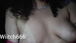 Latina brunette shows off tits on the street.