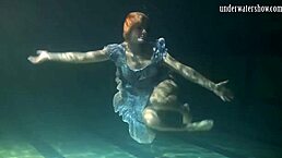 Russian babe’s big tits bounce wildly underwater in pool!