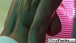 Olivia teases her big tits in the shower