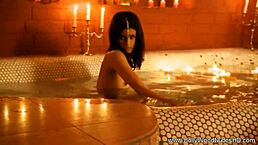 she dances with exotic indian charm, her brunette beauty captivating softly