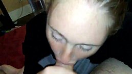 the blonde girl gives a blowjob in a casual setting