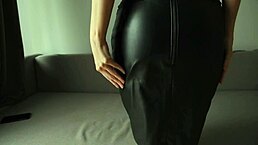 i'm slowly taking off my skirt in leather for spanking