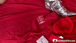 A cute amateur in red lingerie enjoys her toys at home