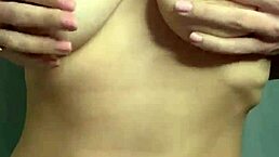 A sexy student teases with her big juicy tits