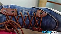 Asian twink slowly removes his socks, teasing shaved toes and feet before solo masturbation leads to intense cumming on hairless body.