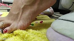 goddess kiffa crushes candies with her red polished feet in domination fetish
