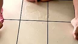 Young girl caresses and squirts hard in her living room, pissing everywhere with a powerful squirt.