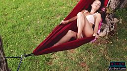 Curvy milf brunette Gloria Sol strips with her natural big tits on display.