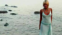 Masha's big tits and shaved pussy revealed in this solo tease.