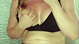 spanish blonde milf with blue eyes pouring oil on her rich tits and fleshy pussy