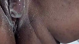 Squirting black whore uses dildo for intense pussy masturbation and orgasmic ass play