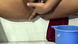 Cute girl fingers pussy in shower