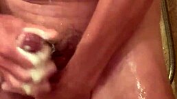 Detailed scene of bathing in the shower with cock
