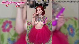 Sweet babe in pink skirt play pink vibrator and sucks lollipop