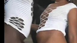 Two hot black girls celebrate new year dancing and flashing their pussies.