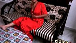 Desi wife Shilpa fingers shaved pussy in red nightwear.