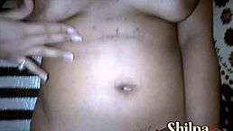 Desi wife Shilpa fingers shaved pussy in red nightwear.