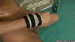 sexy blonde tranny babe jerks off by the pool