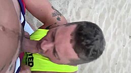 two men share an intimate moment on the public beach