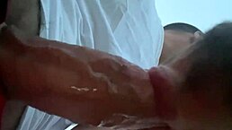 two men share an intimate moment on the public beach