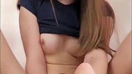 This sexy 18-year-old does a passionate footjob with her dildo at home after college