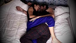 Hidden cam captures couple having passionate sex in bed.