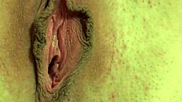 Juicy cherry babe toys her clit close-up in kitchen.