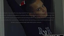 Cute cheerleader Liza Rowe shakes her pom poms in uniform