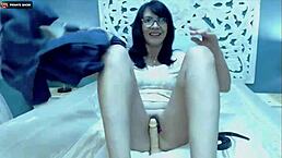 Mature woman performs on webcam in casual setting