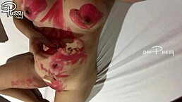 An Amateur Asian Girl Draws on Her Naked Shaved Body with Lipsticks in Close-Up