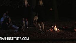 Blonde Gina Gerson feels intense pleasure in threesome at the campfire, with blowjobs and anal