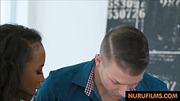 Interracial massage turns into steamy blowjob with petite ebony masseuse. Oiled skin adds extra thrill.