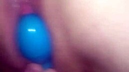 Extreme close-up of wet vibrator in Kona deep.