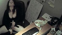 secretary gets caught rubbing her tits and fingering herself at work