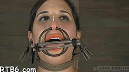 Stunning babe locked in cage with another for nasty wet play