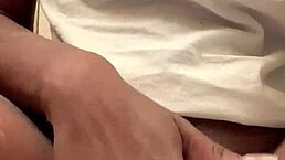 In this scene, a woman masturbates her creamy wet pussy until she squirts