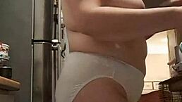 Wife flaunts big panties in kitchen solo show