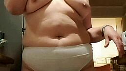 Wife flaunts big panties in kitchen solo show