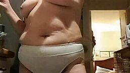 Wife flaunts big panties in kitchen solo show