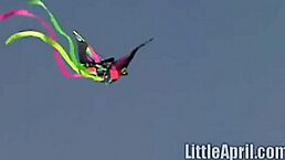 hey, that teen is rubbing her clit outdoors and sucking a popsicle