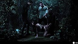 Busty chick with tattoos gets face fucked by three dudes in the forest