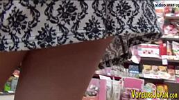 asian chick in big boots gets peed on by voyeur outdoors.