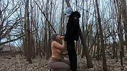 Topless thick amateur sucks cock openly in a public park.