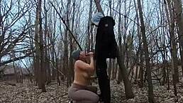 Topless thick amateur sucks cock openly in a public park.