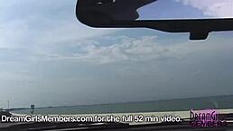 Topless brunette drives her convertible over the skyway bridge, flashing big tits to passersby